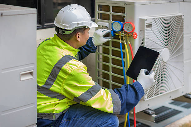 Professional Air Conditioning Repair technician working in Highland, MI